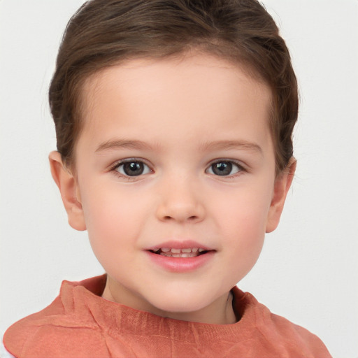 Joyful white child female with short  brown hair and brown eyes