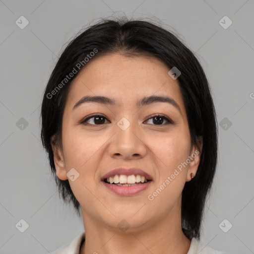 Joyful asian young-adult female with medium  black hair and brown eyes