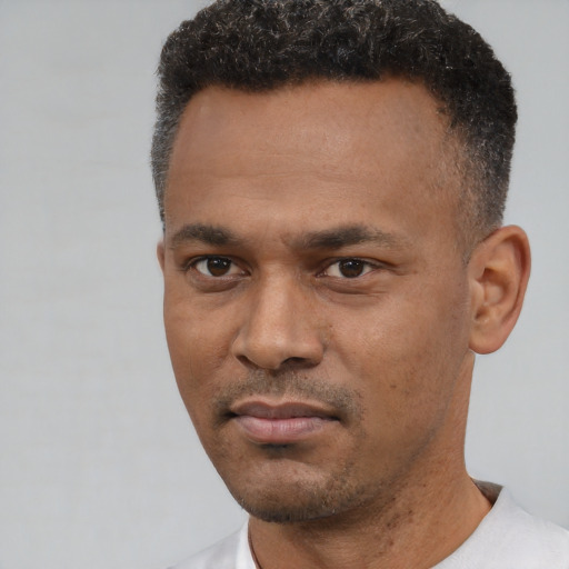 Neutral latino adult male with short  black hair and brown eyes