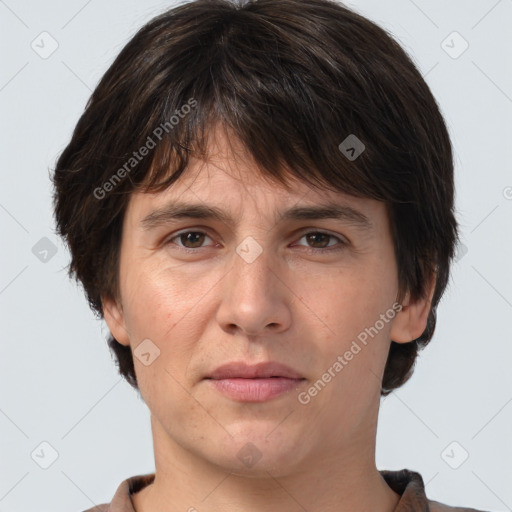 Joyful white adult female with short  brown hair and brown eyes