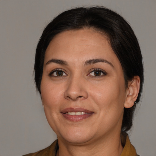 Joyful white adult female with medium  brown hair and brown eyes