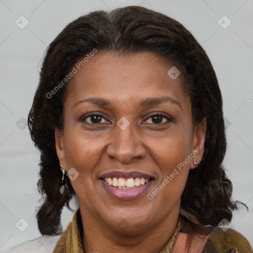 Joyful latino adult female with medium  brown hair and brown eyes