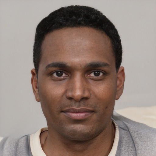 Neutral black young-adult male with short  black hair and brown eyes