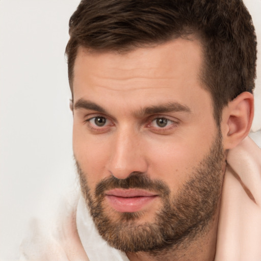 Joyful white adult male with short  brown hair and brown eyes