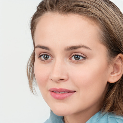 Joyful white young-adult female with medium  brown hair and blue eyes