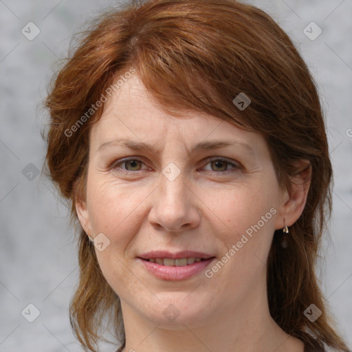 Joyful white adult female with medium  brown hair and grey eyes