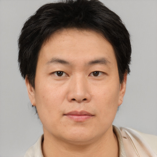 Neutral asian young-adult male with short  brown hair and brown eyes