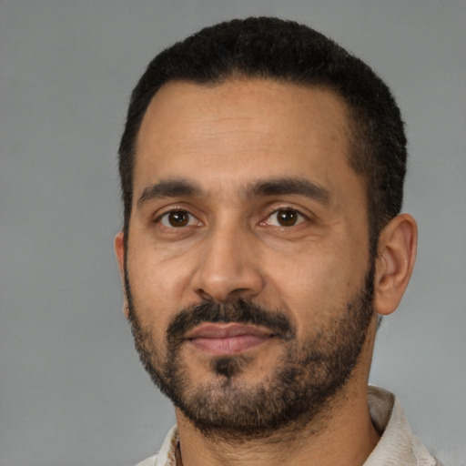 Neutral latino adult male with short  black hair and brown eyes