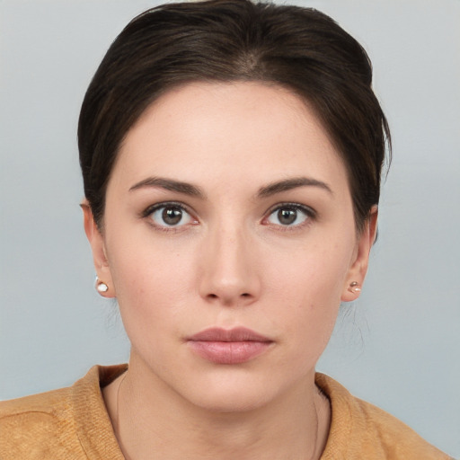 Neutral white young-adult female with medium  brown hair and brown eyes