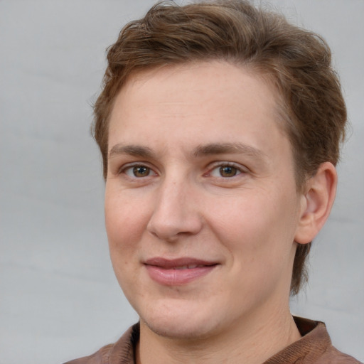 Joyful white adult female with short  brown hair and brown eyes