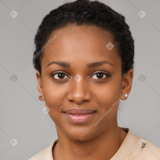 Joyful black young-adult female with short  black hair and brown eyes