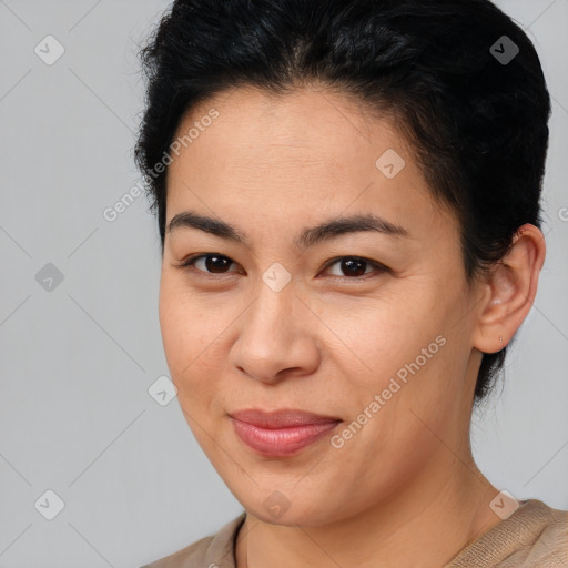 Joyful latino young-adult female with short  brown hair and brown eyes