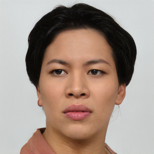 Joyful asian young-adult female with short  black hair and brown eyes