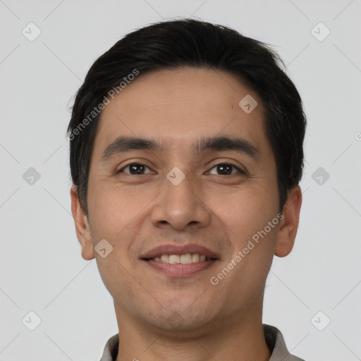 Joyful white young-adult male with short  black hair and brown eyes