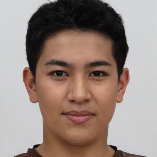 Joyful asian young-adult male with short  brown hair and brown eyes