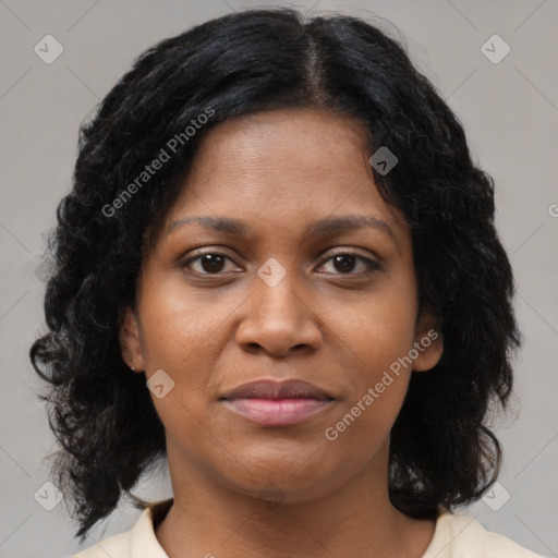 Joyful black young-adult female with medium  brown hair and brown eyes