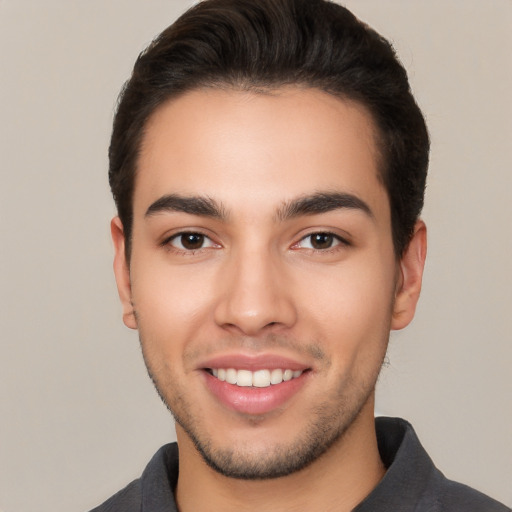 Joyful white young-adult male with short  brown hair and brown eyes