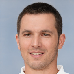 Joyful white young-adult male with short  brown hair and brown eyes