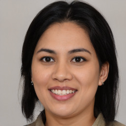 Joyful asian young-adult female with medium  brown hair and brown eyes