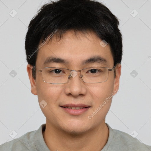 Joyful asian young-adult male with short  brown hair and brown eyes