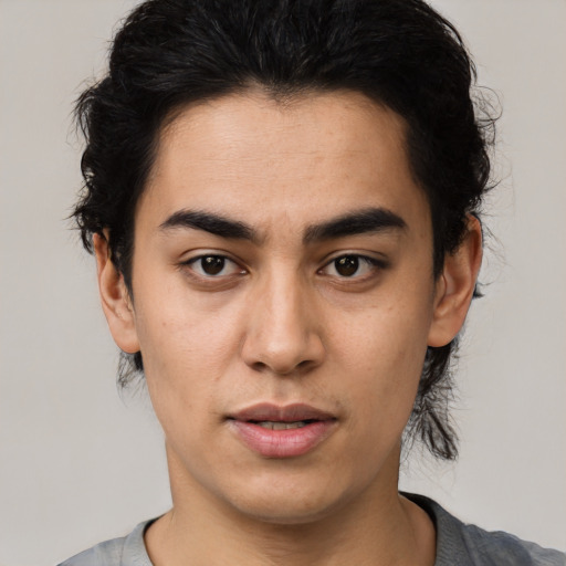 Joyful latino young-adult male with medium  black hair and brown eyes