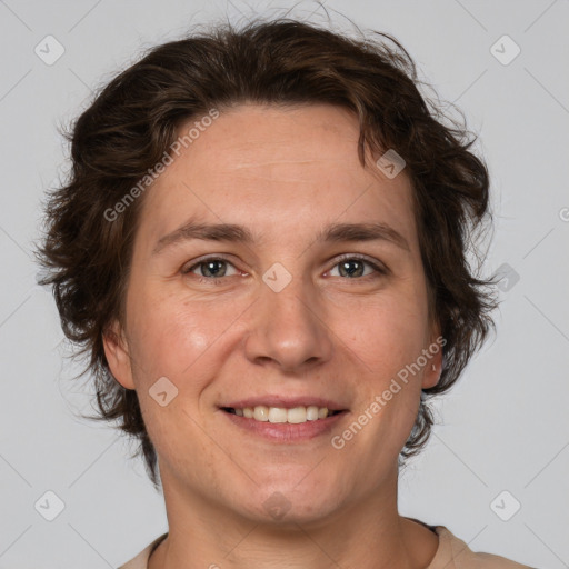 Joyful white adult male with medium  brown hair and brown eyes