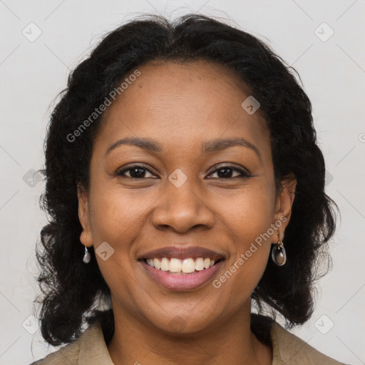 Joyful black young-adult female with long  brown hair and brown eyes