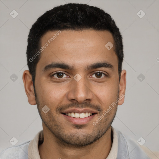 Joyful latino young-adult male with short  black hair and brown eyes