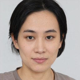 Joyful asian young-adult female with medium  black hair and brown eyes