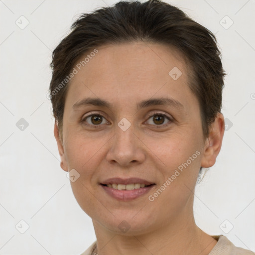 Joyful white adult female with short  brown hair and grey eyes