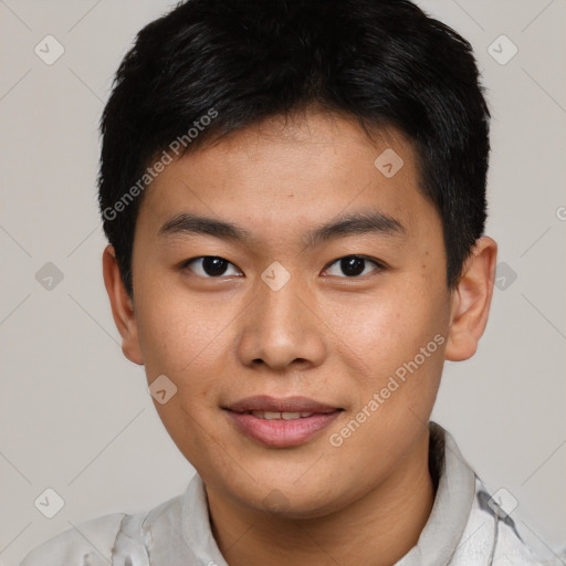 Joyful asian young-adult male with short  brown hair and brown eyes