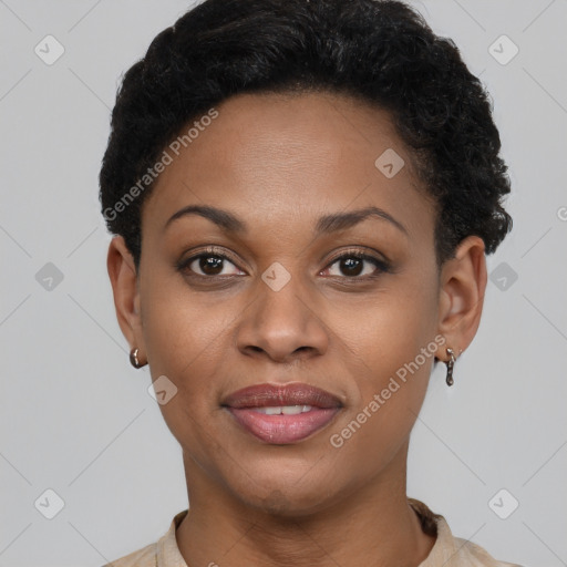 Joyful black young-adult female with short  brown hair and brown eyes