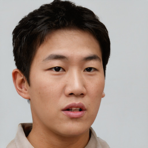 Neutral asian young-adult male with short  brown hair and brown eyes