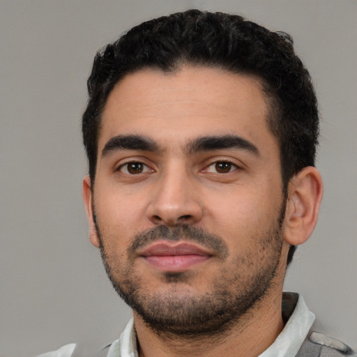 Neutral latino young-adult male with short  black hair and brown eyes