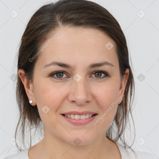 Joyful white young-adult female with medium  brown hair and brown eyes