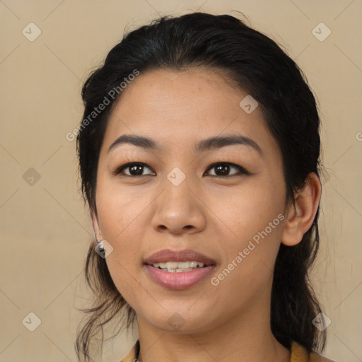 Joyful latino young-adult female with long  brown hair and brown eyes