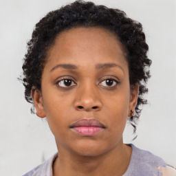 Neutral black young-adult female with short  brown hair and brown eyes