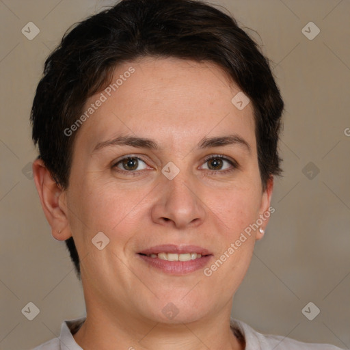 Joyful white adult female with short  brown hair and brown eyes