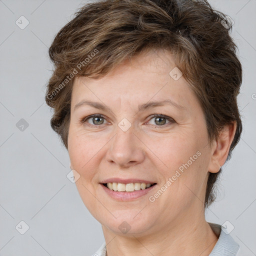 Joyful white adult female with short  brown hair and brown eyes