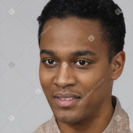 Joyful black young-adult male with short  black hair and brown eyes