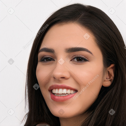 Joyful white young-adult female with long  black hair and brown eyes