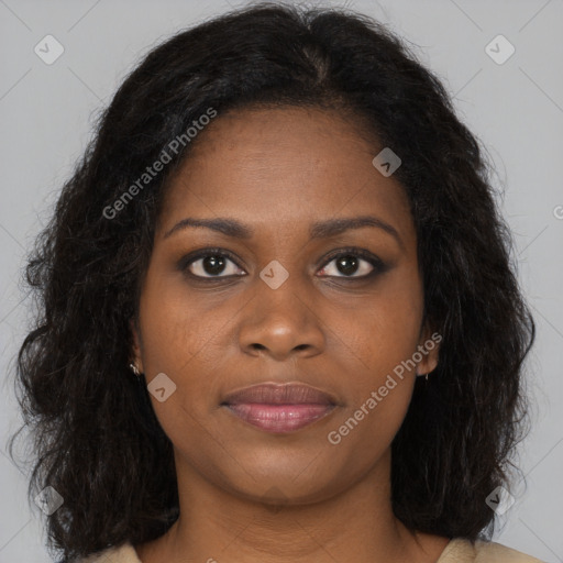 Joyful black young-adult female with long  brown hair and brown eyes