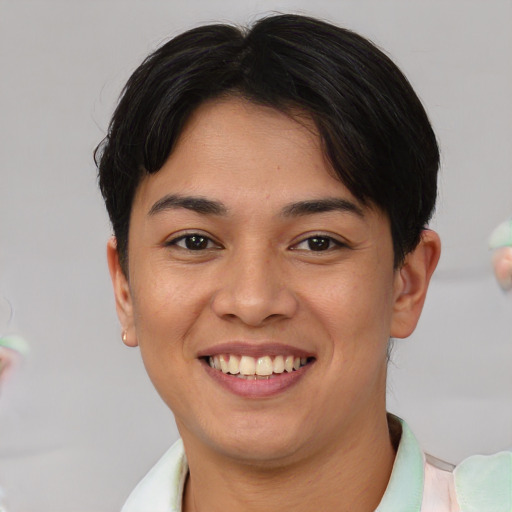 Joyful white young-adult female with short  brown hair and brown eyes