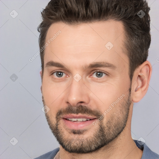 Joyful white adult male with short  brown hair and brown eyes