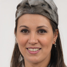 Joyful white adult female with long  brown hair and brown eyes