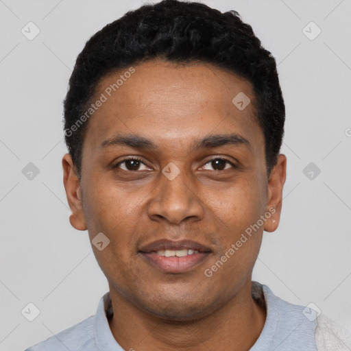 Joyful black young-adult male with short  black hair and brown eyes
