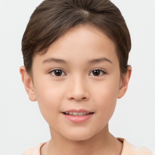 Joyful white child female with short  brown hair and brown eyes