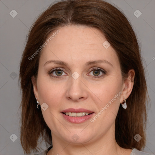 Joyful white adult female with medium  brown hair and grey eyes