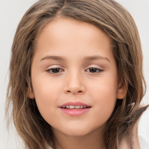 Joyful white child female with long  brown hair and brown eyes