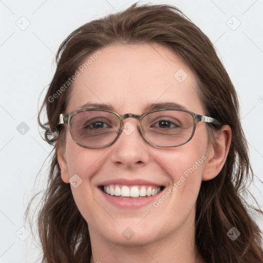 Joyful white young-adult female with long  brown hair and blue eyes